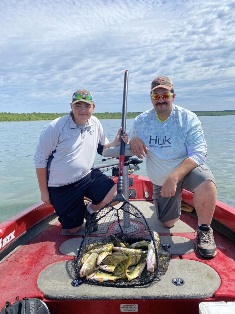 Father/Son duo put the hammer down on jumbo perch and walleyes out on Cass Lake while fishing with Corbin Hime of Cass Lake Area Guide Service.