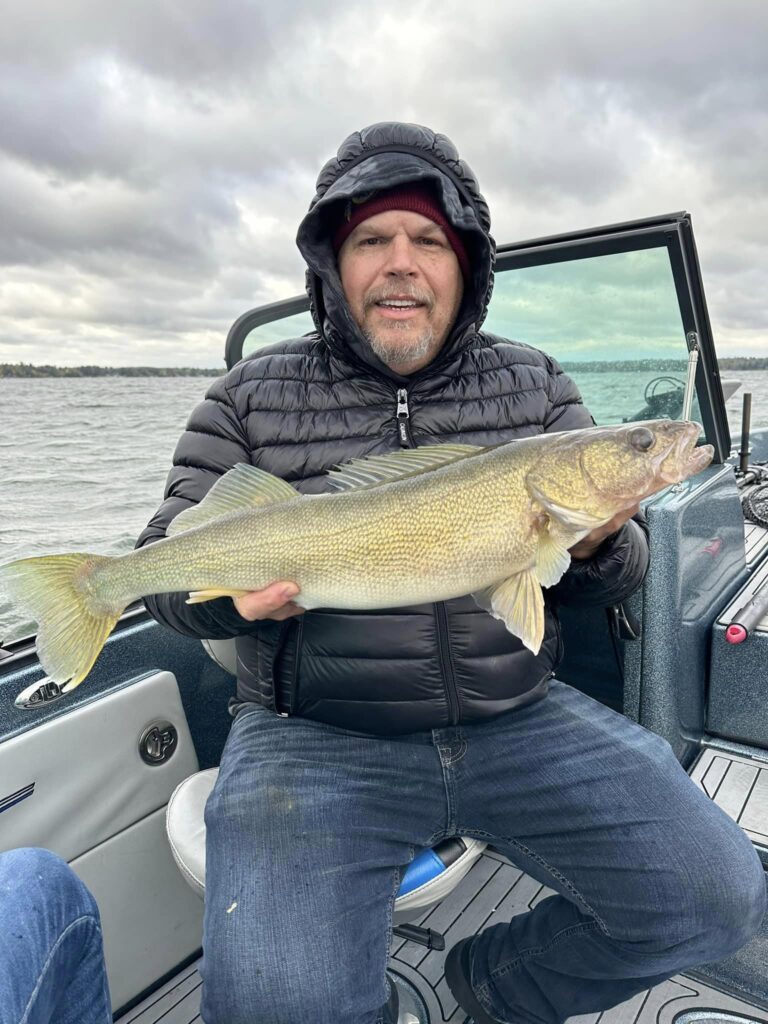 Cass Lake Area Guide Service client with a big Bemidji Area lake walleye.