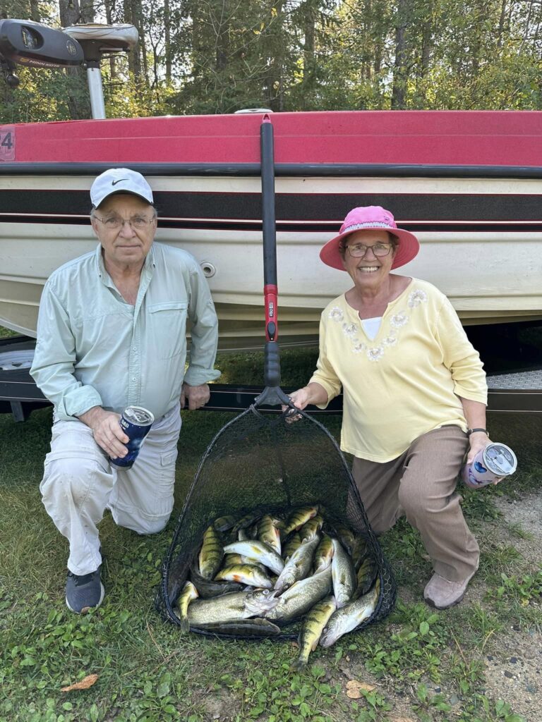 Lovely couple with a new full of fish from Lake Bemidji while fishing with Cass Lake Area Guide Service.